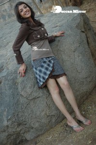 Actress Kajal Aggarwal in a brown coat and grey skirt