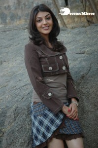 Actress Kajal Aggarwal in a brown coat and grey skirt