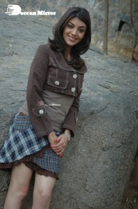 Actress Kajal Aggarwal in a brown coat and grey skirt