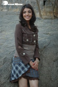 Actress Kajal Aggarwal in a brown coat and grey skirt