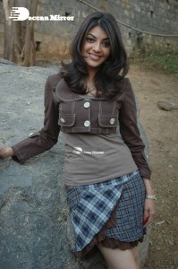 Actress Kajal Aggarwal in a brown coat and grey skirt