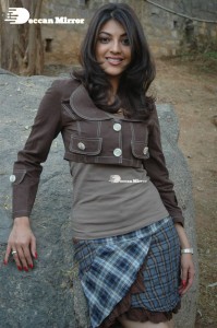 Actress Kajal Aggarwal in a brown coat and grey skirt