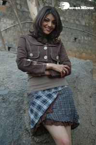 Actress Kajal Aggarwal in a brown coat and grey skirt