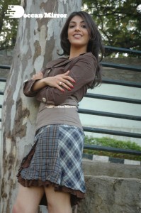 Actress Kajal Aggarwal in a brown coat and grey skirt
