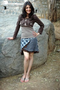 Actress Kajal Aggarwal in a brown coat and grey skirt