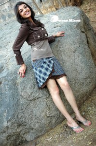 Actress Kajal Aggarwal in a brown coat and grey skirt