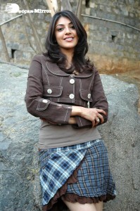 Actress Kajal Aggarwal in a brown coat and grey skirt