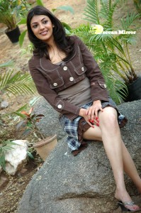 Actress Kajal Aggarwal in a brown coat and grey skirt