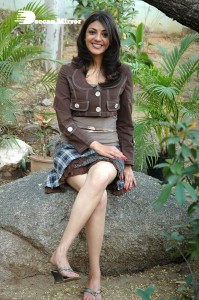 Actress Kajal Aggarwal in a brown coat and grey skirt