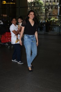 actress Kajal Aggarwal stylish in a black top and denim jeans at mumbai airport