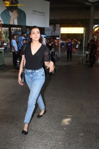 actress Kajal Aggarwal stylish in a black top and denim jeans at mumbai airport