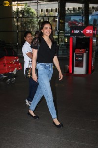 actress Kajal Aggarwal stylish in a black top and denim jeans at mumbai airport