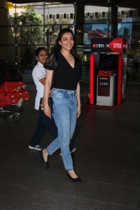 actress Kajal Aggarwal stylish in a black top and denim jeans at mumbai airport