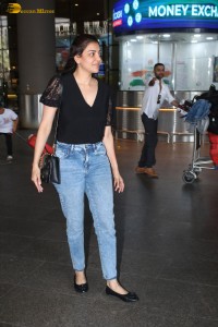 actress Kajal Aggarwal stylish in a black top and denim jeans at mumbai airport