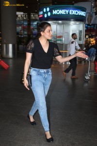 actress Kajal Aggarwal stylish in a black top and denim jeans at mumbai airport