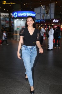 actress Kajal Aggarwal stylish in a black top and denim jeans at mumbai airport
