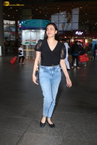 actress Kajal Aggarwal stylish in a black top and denim jeans at mumbai airport
