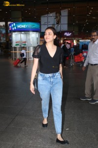 actress Kajal Aggarwal stylish in a black top and denim jeans at mumbai airport
