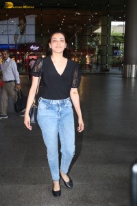 actress Kajal Aggarwal stylish in a black top and denim jeans at mumbai airport