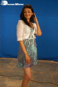 Actress Kajal Aggarwal in a green dress and a white coat