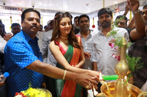 Bollywood and Telugu Actress Kajal Aggarwal in a green saree at a store opening function