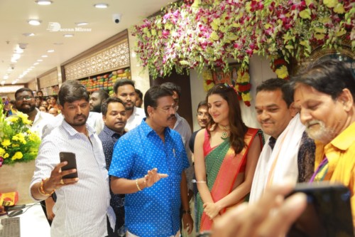 Bollywood and Telugu Actress Kajal Aggarwal in a green saree at a store opening function
