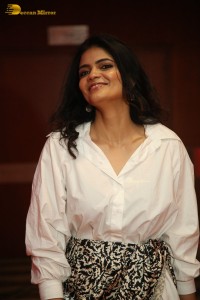 Indian Actress Kalpika Ganesh in a white shirt