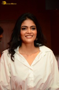 Indian Actress Kalpika Ganesh in a white shirt