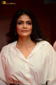 Indian Actress Kalpika Ganesh in a white shirt