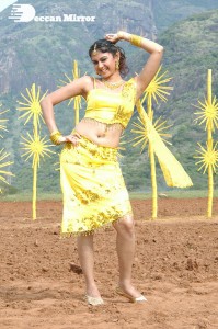 Actress Kamna Jethmalani in a yellow dress during a film shoot