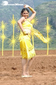 Actress Kamna Jethmalani in a yellow dress during a film shoot