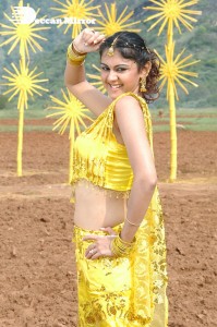 Actress Kamna Jethmalani in a yellow dress during a film shoot