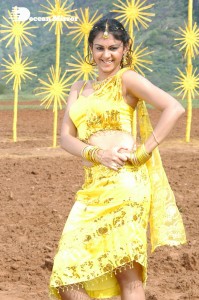 Actress Kamna Jethmalani in a yellow dress during a film shoot