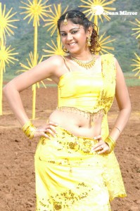 Actress Kamna Jethmalani in a yellow dress during a film shoot