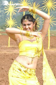 Actress Kamna Jethmalani in a yellow dress during a film shoot