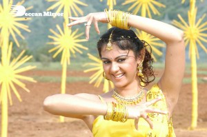 Actress Kamna Jethmalani in a yellow dress during a film shoot