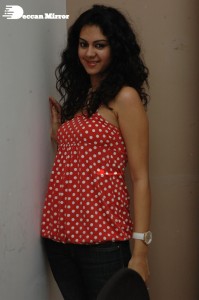 Kamna Jethmalani in a white dotted orange top and jeans