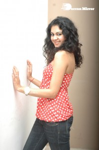 Kamna Jethmalani in a white dotted orange top and jeans