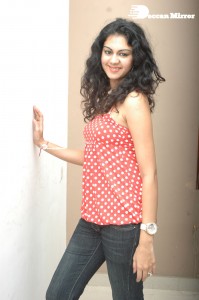 Kamna Jethmalani in a white dotted orange top and jeans