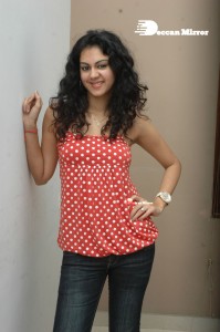 Kamna Jethmalani in a white dotted orange top and jeans