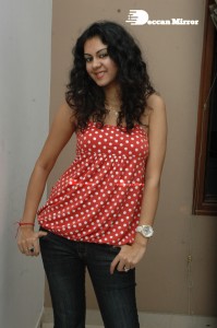 Kamna Jethmalani in a white dotted orange top and jeans