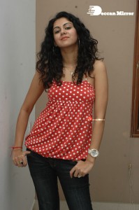 Kamna Jethmalani in a white dotted orange top and jeans