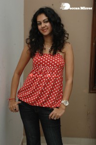 Kamna Jethmalani in a white dotted orange top and jeans
