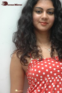 Kamna Jethmalani in a white dotted orange top and jeans