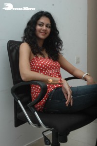Kamna Jethmalani in a white dotted orange top and jeans