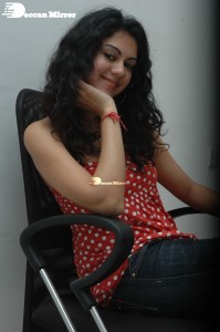 Kamna Jethmalani in a white dotted orange top and jeans