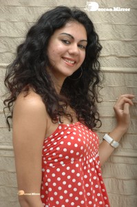 Kamna Jethmalani in a white dotted orange top and jeans