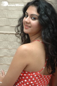 Kamna Jethmalani in a white dotted orange top and jeans