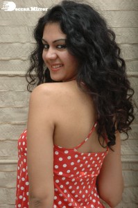 Kamna Jethmalani in a white dotted orange top and jeans