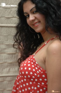 Kamna Jethmalani in a white dotted orange top and jeans